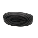 A side profile of the closed black sunglasses case, emphasizing its "chunky" protective silhouette and the seamless wrap-around zebra print.