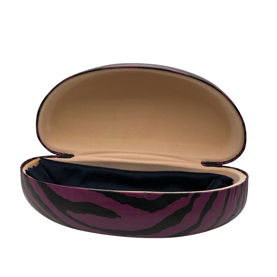 An angled perspective of the open purple ZEBRA case, highlighting the protective hard-shell structure and the contrast between the grey zebra-print exterior and the soft tan interior.