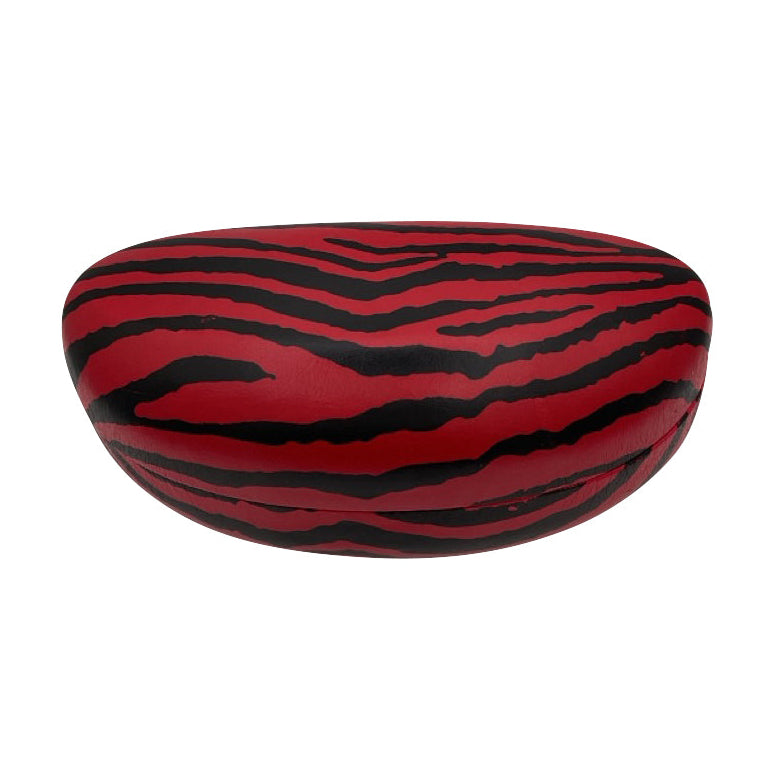 A high-angle view of the closed red ZEBRA case, displaying the full grey and black zebra stripe pattern across the smooth, rounded top surface.
