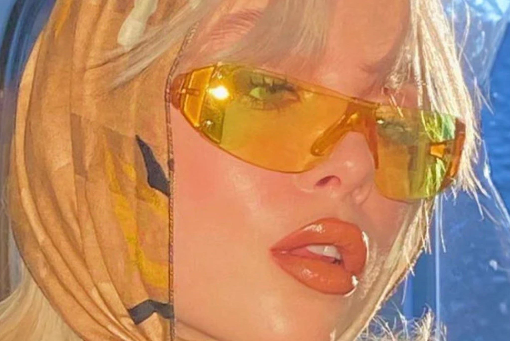 model wearing colorful yellow lens sunglasses linking to the colored lens sunglasses collection
